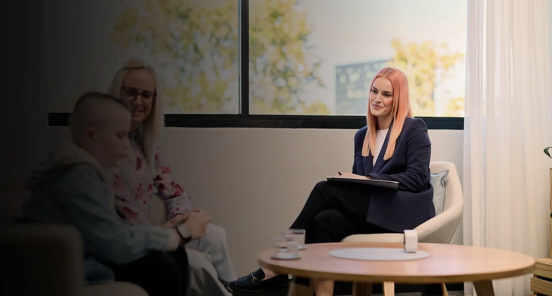 Psychologist talking with a client in a bright consulting room